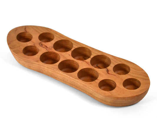 red cherry essential oil boat display for bottles