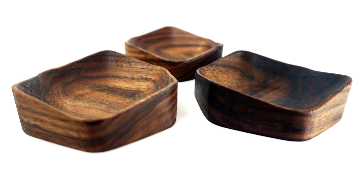 close detail of wooden carved jewelry dishes