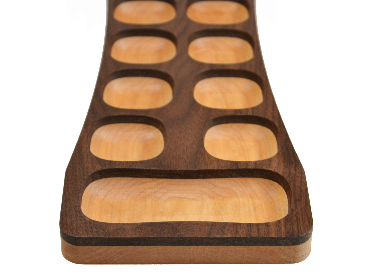light wood mancala game board with dark layered top