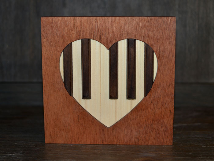 realistic piano keys sculpture with heart