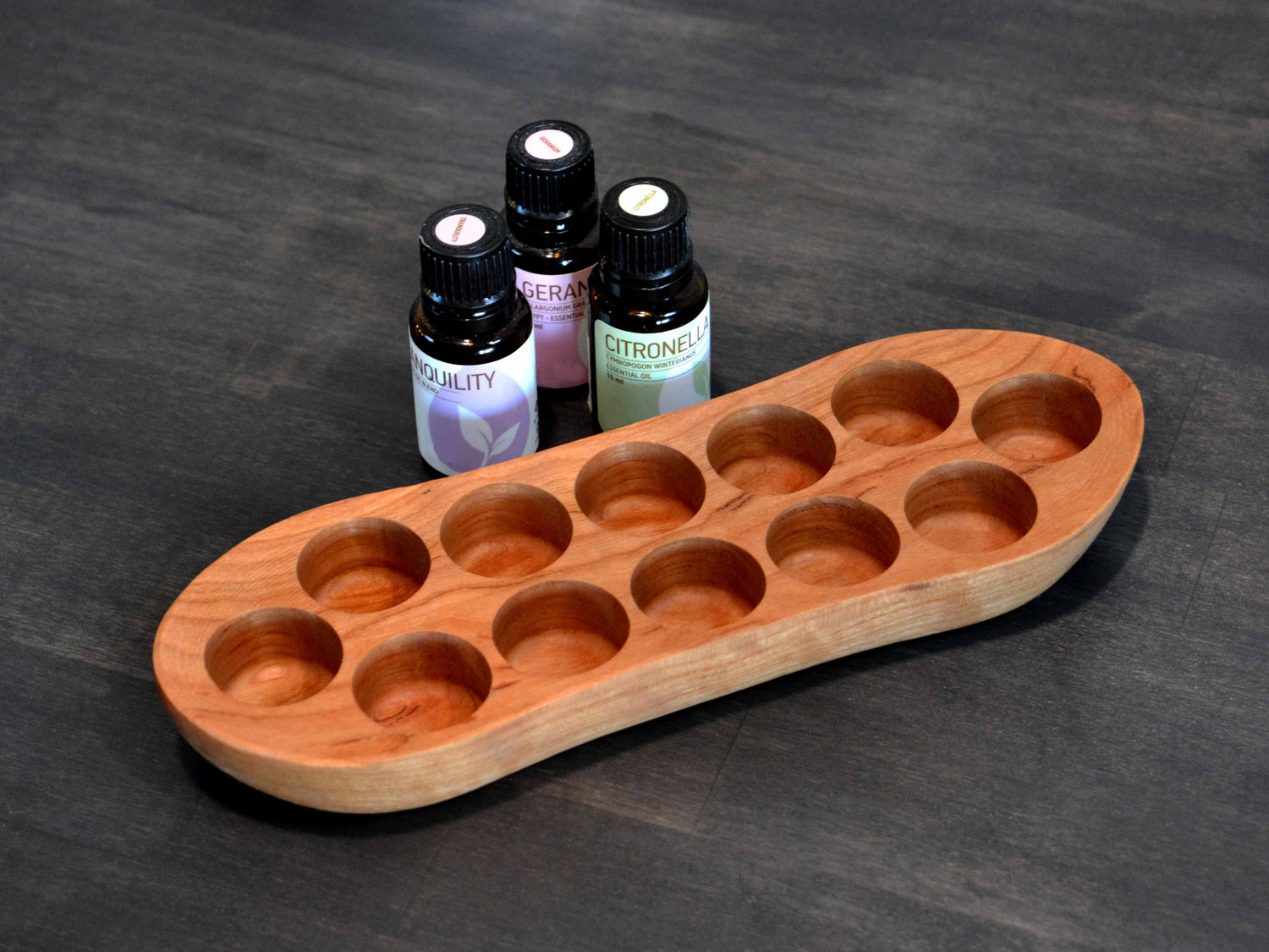 RMO oils with wooden boat display holder
