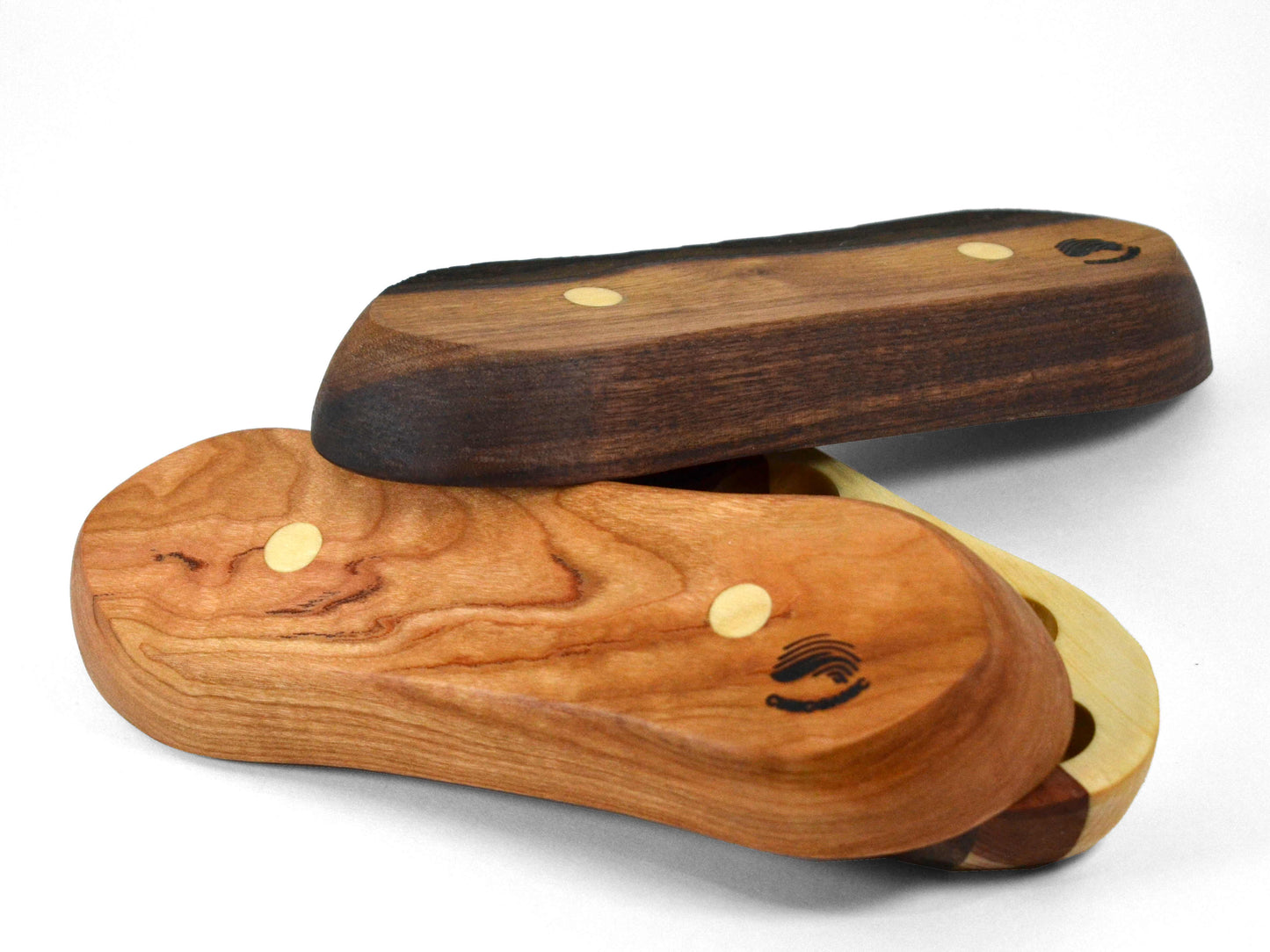 underside of walnut, cherry, and striped tyke essential oil boats
