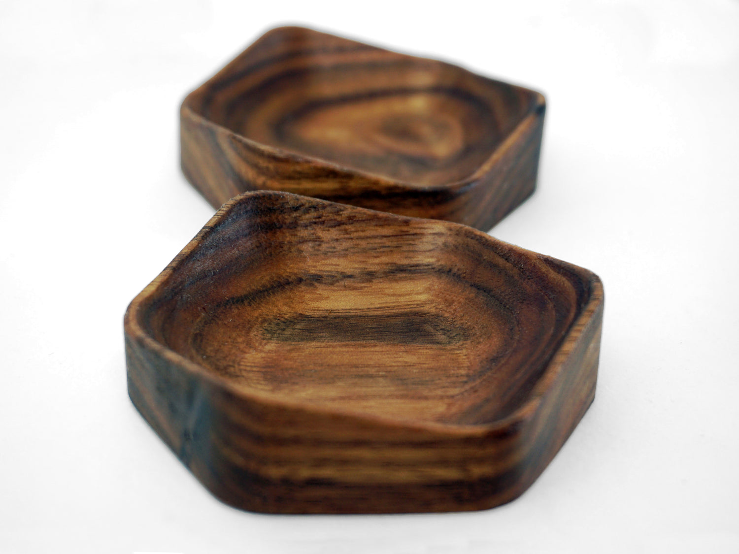 two handcrafted ring dishes with six sided design