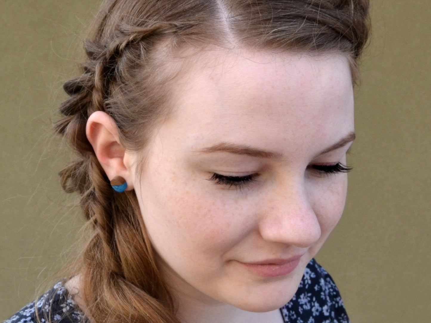 dark walnut and ocean blue stud earrings on model