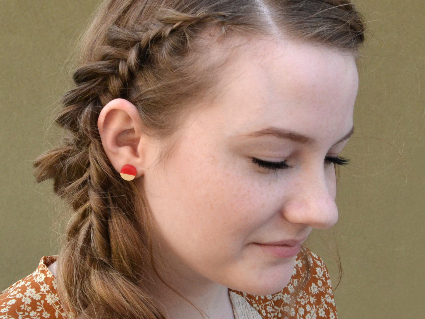 girl wearing apple red and white maple stud earrings