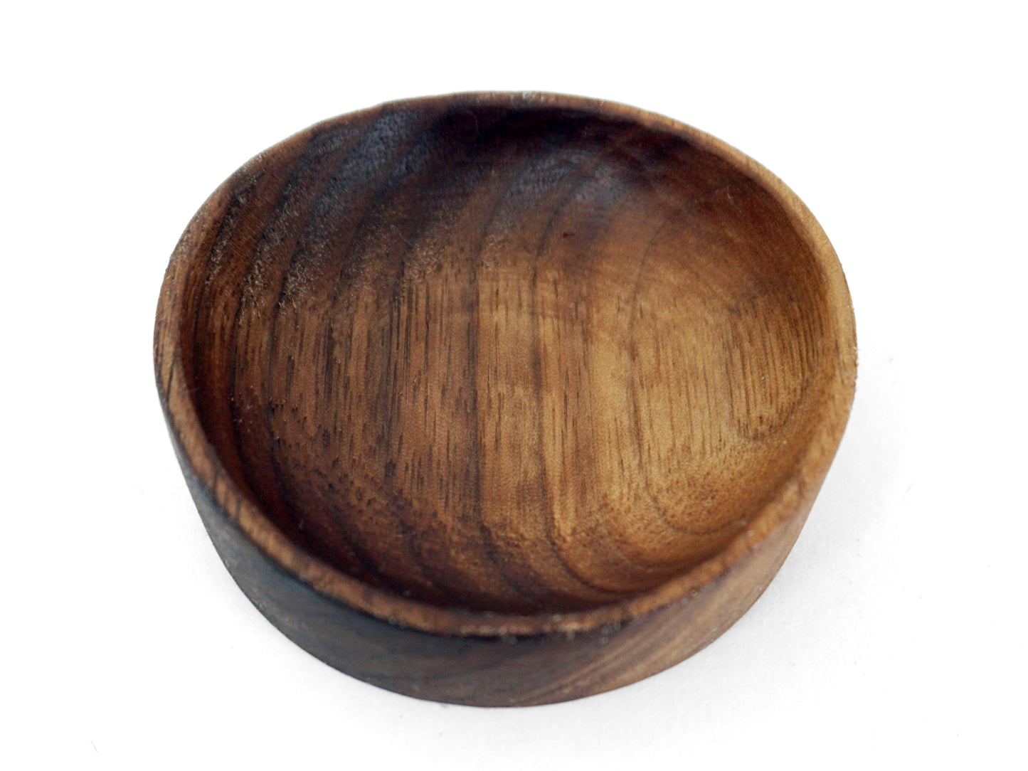 single circular dark walnut wood ring dish with natural wood grain