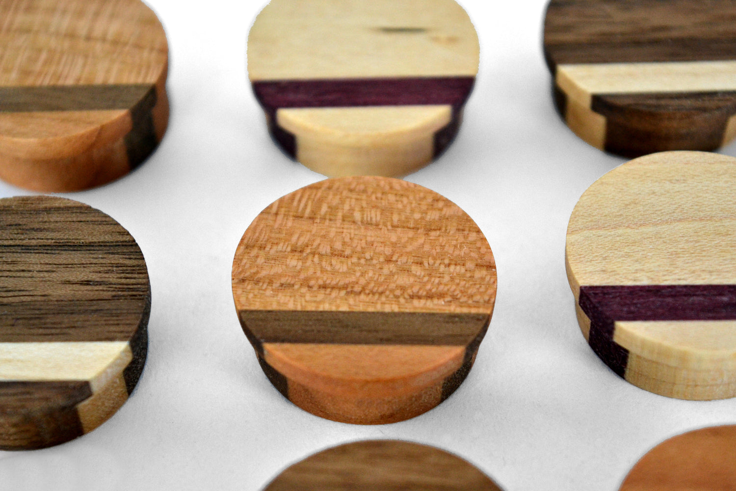 quarter sawn cherry wood magnet with flecks, part of a set of assorted colorful wood magnets for the kitchen